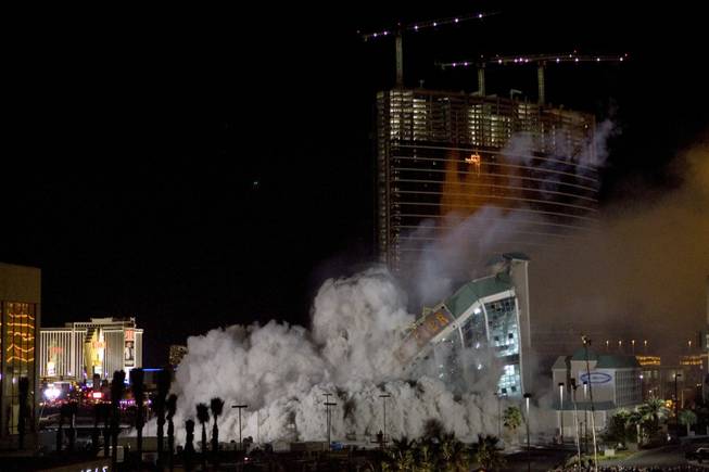 The New Frontier hotel tower crashes to the ground as it is imploded in Las Vegas, Nevada November 13, 2007. The casino on The Las Vegas Strip was purchased by Elad properties, an Israeli-owned real estate investment group, for more than U.S. $1.2 billion in May 2007. Elad Group, which also owns the Plaza hotel in New York, and the IDB Group are expected to build a Plaza-themed multi-billion dollar megaresort on the site.